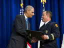 Captain Edwin Lynn O’Berry of Palm Beach County, FL receives his award certificate from the Attorney General.