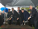 In a driving rain, Boston Police Officer Thomas Griffiths; Attorney General Eric Holder; Craig W. Floyd, chairman of National Law Enforcement Museum Memorial Fund; Homeland Security Secretary Janet Napolitano; and House Majority Leader Steny Hoyer (D-Md.) ceremonially shoveled dirt in an important step to make the museum a reality.