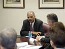 Attorney General Holder, sitting down with EOIR employees.