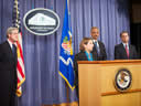 FBI Director Robert Mueller, Attorney General Eric Holder, and U.S. Attorney for the Southern District of New York Prett Bharara look on to Assistant Attorney General for National Security Lisa Monaco, as she recognizes the efforts of the multiple agencies and offices that participated in the investigation.