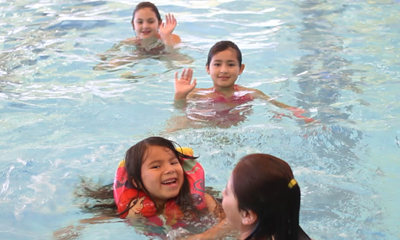 Kids take a swim as members of the Diabetes Prevention Program