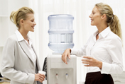 Women talking at the office water cooler