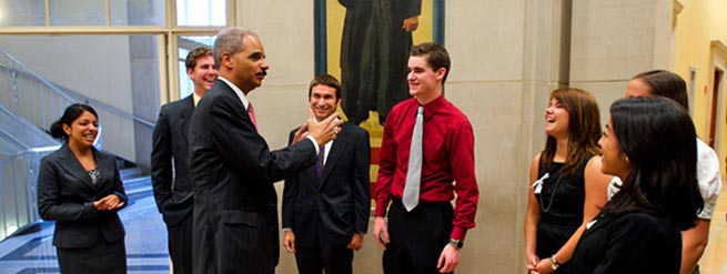Photo of Attorney General Eric Holder and Interns