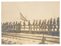 Thumbnail for: Photograph of Troops Marching Next to Railroad Tracks, 