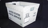 A white plastic tub with 'United States Postal Service' printed on it in black