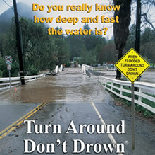 flooded road with Turn Around Don't Drown sign