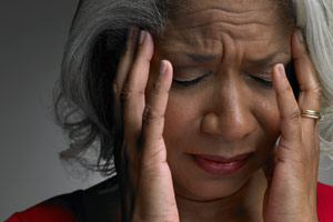 woman holding her head