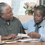 A couple looking at checkbook
