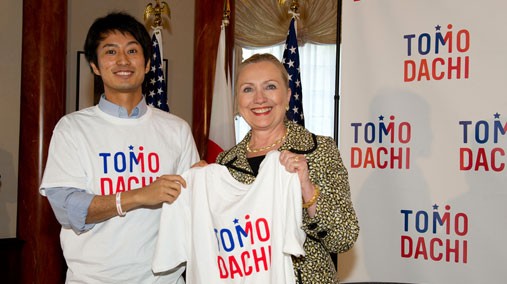 U.S. Secretary of State Hillary Rodham Clinton poses for a photo with a member of the Tomodachi program youth in Tokyo, Japan, on July 8, 2012. [State Department photo by William Ng/ Public Domain]
