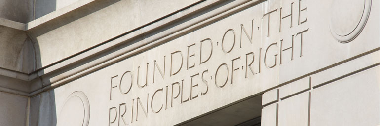 Photograph of the inscription reading 'Founded on the Principles of Right' from the DOJ building.