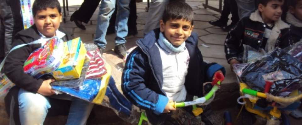 Children playing on the new Al Rabee playground