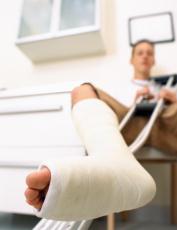 Photograph of a teenage boy with a cast on his leg