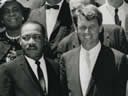 Attorney General Robert F. Kennedy stands besides the Reverend Martin Luther King, Jr.