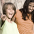 photo of a boy pointing and a girl laughing