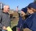 Homeowner Mike Gallagher, (L), receives information from FEMA Community Relations Specialists Angela Lynn, (C), and Maribel Rovira, (R). FEMA is working with state and local officials to assist residents who were affected by Hurricane Sandy. Location: 