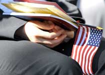 New citizen holding a U.S. flag