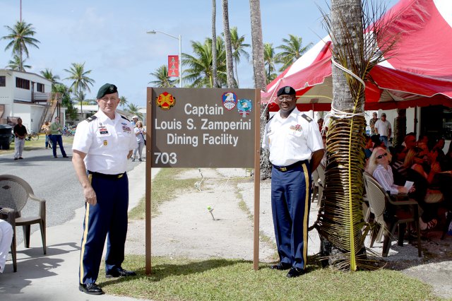 U.S. Army Kwajalein Atoll Commander Col. Shannon Boehm, left, and Sgt. Maj. Roderick Prioleau unveil the new sign for the rededicated dining hall on Kwajalein.