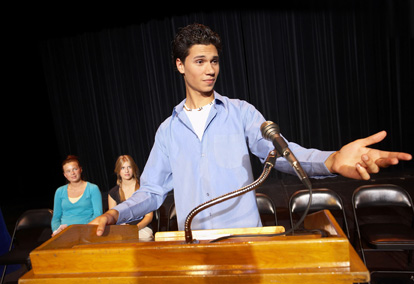 A young man makes a speech.