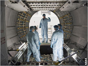 The shuttle crew get to know the inside of the Raffaello module where the supplies are stored for their trip to the space station.