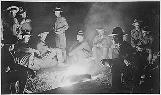 "Around the camp-fire, men of Company A, 16th Infantry, San Geronimo, Mexico, May 27th, 1916."