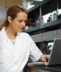 Woman researcher looking at computer screen