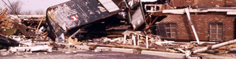 April 3rd, 1974. A truck lays on top of a demolished brick building. Ohio Historical Society 