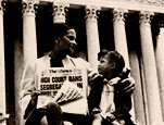 Woman and girl on steps of Supreme Court