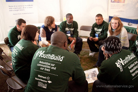 Young people from volunteer group sit in a circle talking. Photograph courtesy of Corporation for National & Community Service.