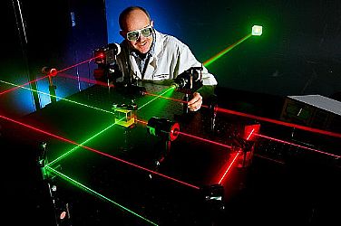 Daniel King, Microwave/Electro-Optic (MS32) electronics engineer at Naval Surface Warfare Center (NSWC), Corona Division, prepares alignment of various optical components using eye-safe visible lasers. Under the Navy Metrology Research and Development Program, NSWC Corona's E-O Group has developed and patented two calibration standards for support of laser designator and rangefinder test sets. The laser transmitter supports standards keeps ordnance on target and reduces the cost of maintenance for the fleet.  U.S. Navy photo by Greg Vojtko (Released)  110519-N-HW977-022