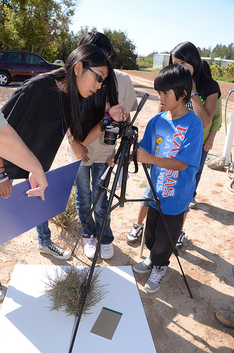 Pueblo of Acomo students take digital pictures of blackbrush canopy that will be used to determine exact crown coverage.