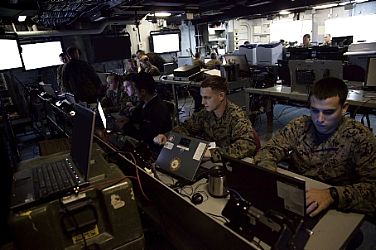 Marines with 26th Marine Expeditionary Unit (MEU) conduct operations in the Landing Force Operation Center aboard the USS Kearsarge (LHD 3) while underway, Jan. 31, 2013. The 26th MEU and Amphibious Squadron 4 are currently undergoing Deploying Ground Systems Integration Testing in which a group of contractors are ensuring all systems on the ship are properly operating before the MEUâ€™s upcoming deployment. The 26th MEU is conducting Composite Training Unit Exercise, the final phase of a six-month pre-deployment training program. The 26th MEU operates continuously across the globe, providing the president and unified combatant commanders with a forward-deployed, sea-based quick reaction force. The MEU is a Marine Air-Ground Task Force capable of conducting amphibious operations, crisis response and limited contingency operations.  U.S. Marine Corps photo by Cpl. Christopher Q. Stone (Released)  130131-M-SO289-004