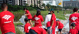 Photograph of people cleaning up a park, wearing Bank of America t-shirts.
