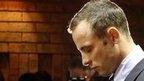 Oscar Pistorius stands at the dock 