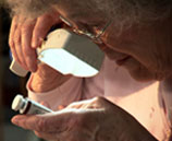 Woman using a vision device.