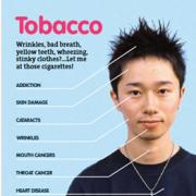 Photo of a young man diagramming the effects of tobacco on the body.
