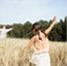 Thumbnail Of Child playing Airplane In Field
