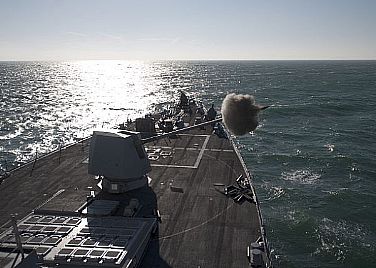The guided-missile destroyer USS James E. Williams (DDG 95) fires the Mk-45 5-inch/62 caliber lightweight gun during a live-fire shore bombardment exercise. James E. Williams is part of the Enterprise Carrier Strike Group, which is underway conducting a composite training unit exercise (COMPTUEX).  U.S. Navy photo by Mass Communication Specialist 3rd Class Daniel J. Meshel (Released)  120112-N-NL401-141