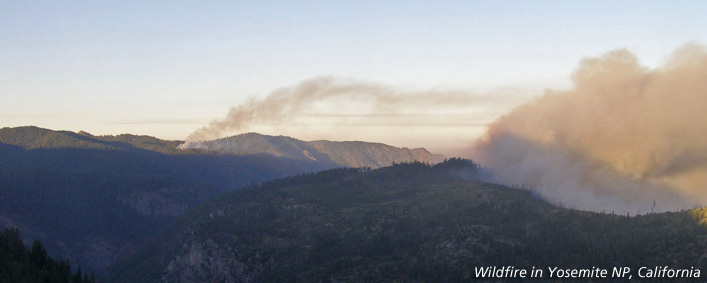 Wildfire smoke rises above Turtleback Dome in Yosemite NP, California