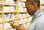 Woman examines a health product in a store.
