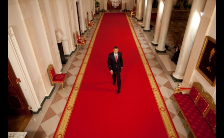 President Obama walks down the Cross Hall of the White House, March 24, 2009. (Official White House Photo by Chuck Kennedy)