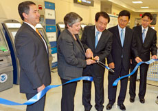 Acting CBP Commissioner David Aguilar, left, Homeland Security Secretary Janet Napolitano, Republic of Korea Minister of Justice Jae Jim Kwon and members of the Korean delegation cut a ceremonial ribbon opening  reciprocal Korea-U.S. trusted traveler program.