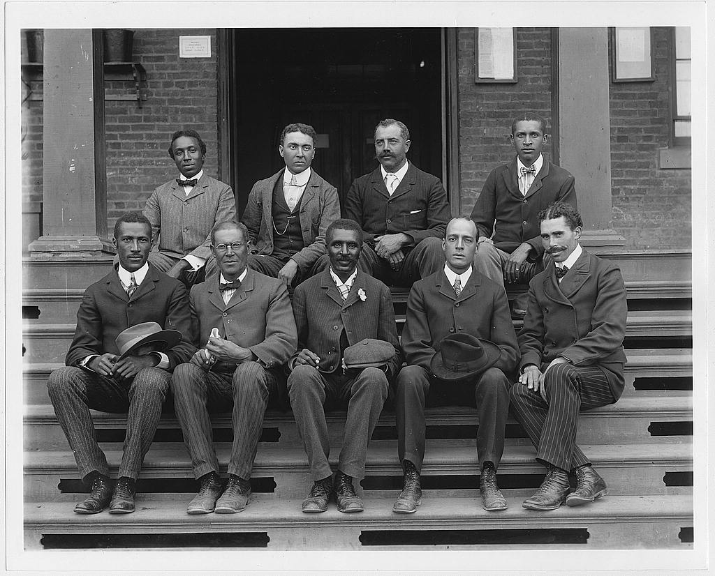 [George Washington Carver, full-length portrait, seated on steps, facing front, with staff]. Photo by Frances B. Johnston, ca. 1902. http://hdl.loc.gov/loc.pnp/ppmsca.05633