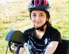 Date: 02/21/2013 Description: Azima, a Pakistani student in the YES program who was born without hands or feet, rides a specially modified bike for the first time in her Eugene, Oregon, host family's neighborhood.  Photo by Harriet Behm, Feb. 2013 State Magazine.