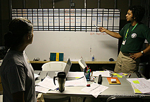 A young man and woman study a whiteboard together. Photograph courtesy of Corporation for National and Community Service.