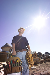 worker with glaring sun to his back