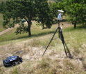 A wireless video camera records in the field