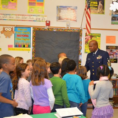 Photo: Master Chief Petty Officer George Lopez meets with students at W. H. Taylor Elementary School while serving as Principal for a Day on Wednesday, Feb. 13, 2013. Master Chief Lopez shadowed Taylor principal Mary Ann Bowen around the school to meet with students and teachers and hoped to lay foundations for further partnership between Coast Guard personnel and Taylor students. U.S. Coast Guard photo by Lt. j.g. Matthew Malacaria.