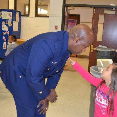 Photo: A student asks Master Chief Petty Officer George Lopez about his service ribbons during a Principal for a Day event at W. H. Taylor elementary school Wednesday, Feb. 13, 2013. Master Chief Lopez shadowed Taylor principal Mary Ann Bowen around the school to meet with students and teachers and hoped to lay foundations for further partnership between Coast Guard personnel and Taylor students. U.S. Coast Guard photo by Lt. j.g. Matthew Malacaria.