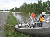  [Photo: USGS personnel from the Missouri Water Science Center pause for a break while making measurements at the Birds Point-New Madrid Floodway.] 