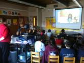 A class from Angoon City School watches a Digital Storytelling presentation
